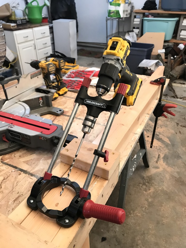 Drill jig for drilling holes in post. 