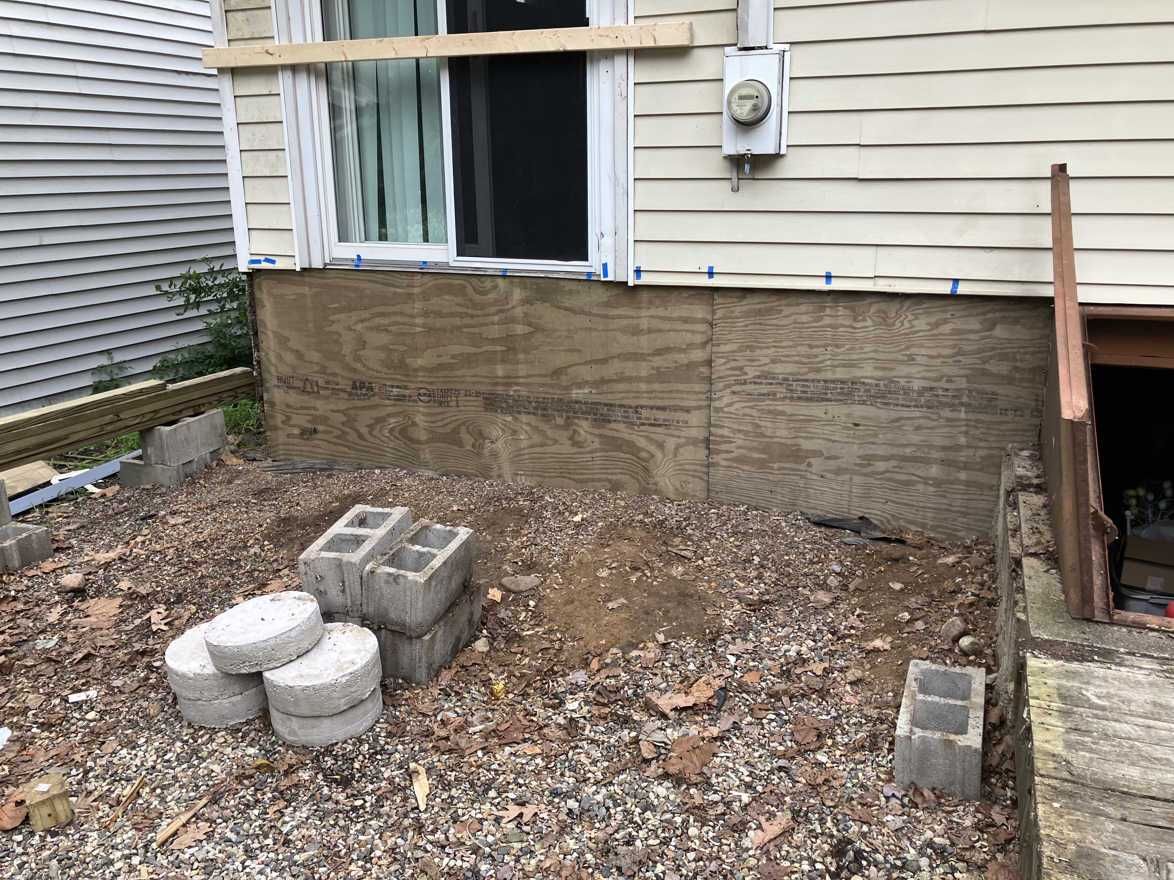 Repairs to the damaged foundation prior to installing the framing for the new deck. 