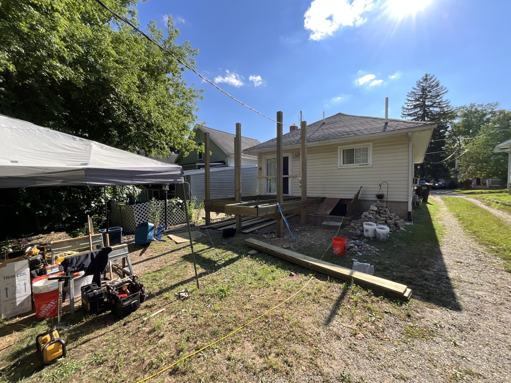 Installing the posts and framing for the new porch