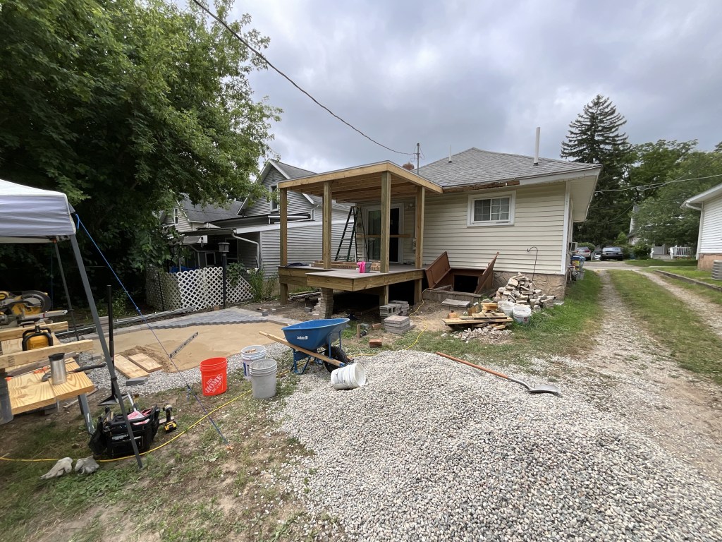 Installing the roof and decking on a new porch. 