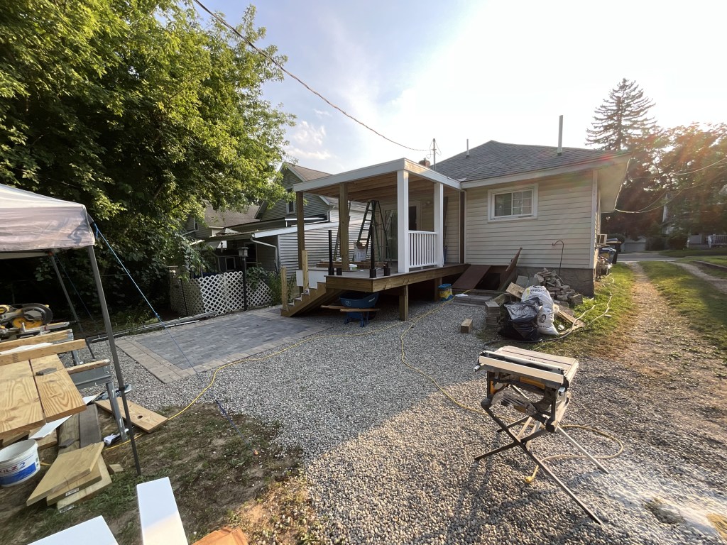 Installing the siding and railings on the new porch and patio. 